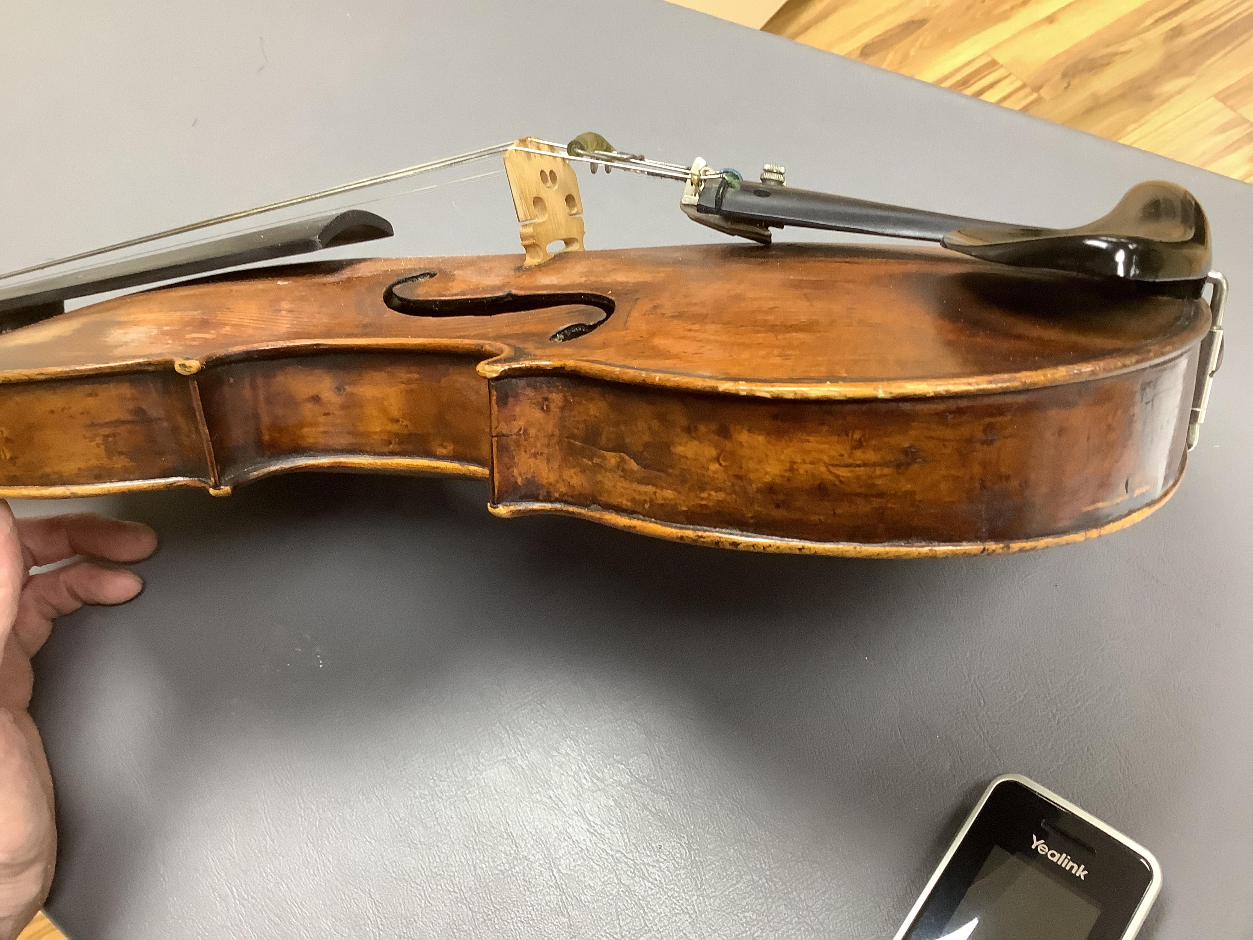 An interesting late 18th century violin, with one piece bird’s eye maple back, unsigned, with two silver fully mounted octagonal bows, one stamped Voight CITES Submission reference, 3XFNUBT7 and Submission reference, RHL